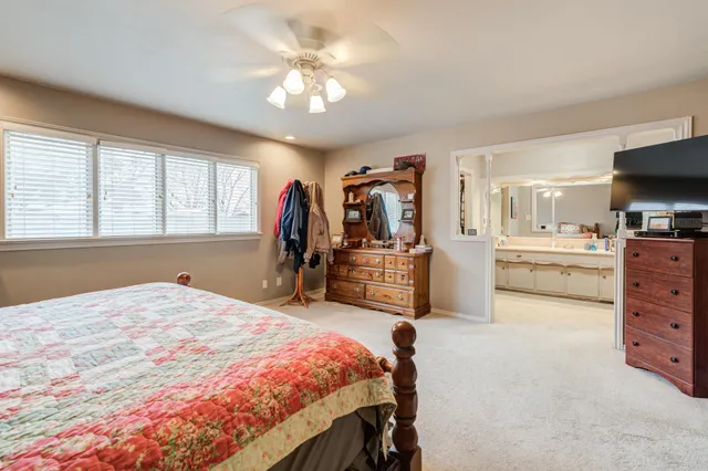 a bed room with a bed and a television