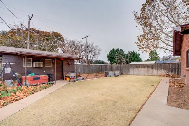 a view of a house with a patio and sitting area