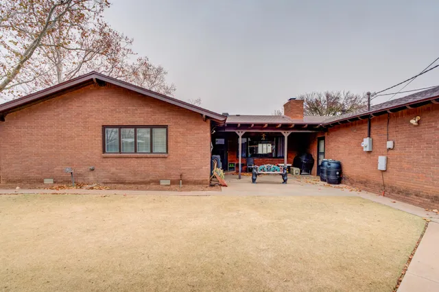 a view of a house with patio and sitting area