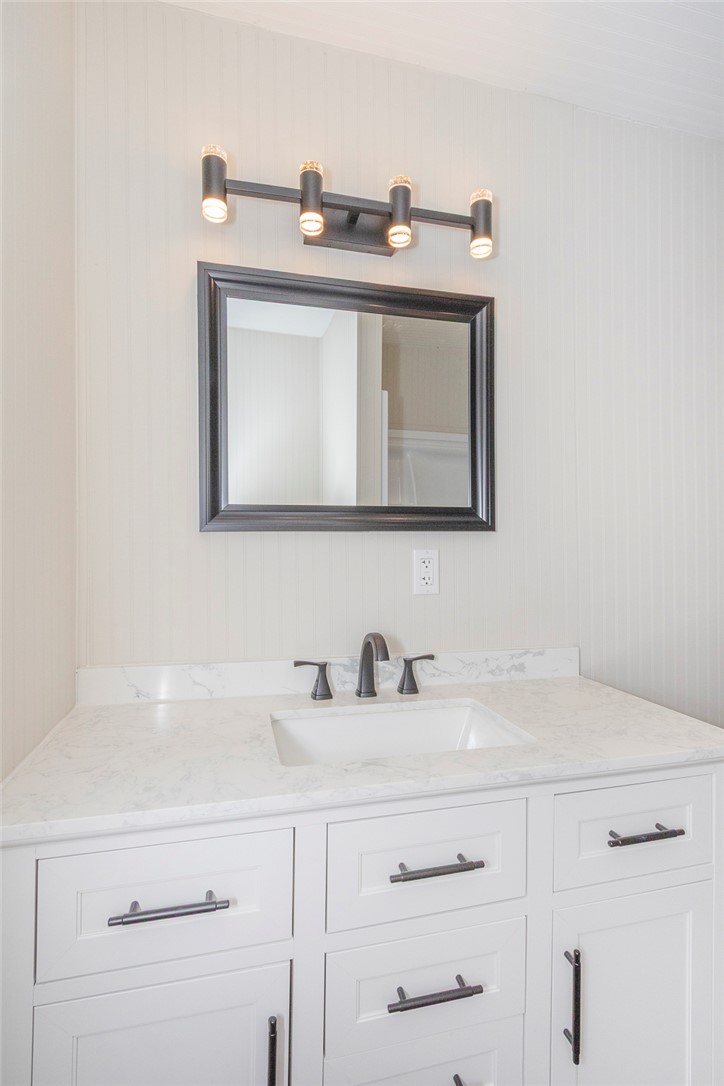 113 Linda Lane Honea Path, SC 29654 - Photo 32 of 36 This modern bathroom features a stylish vanity, sleek countertop, and a contemporary mirror.