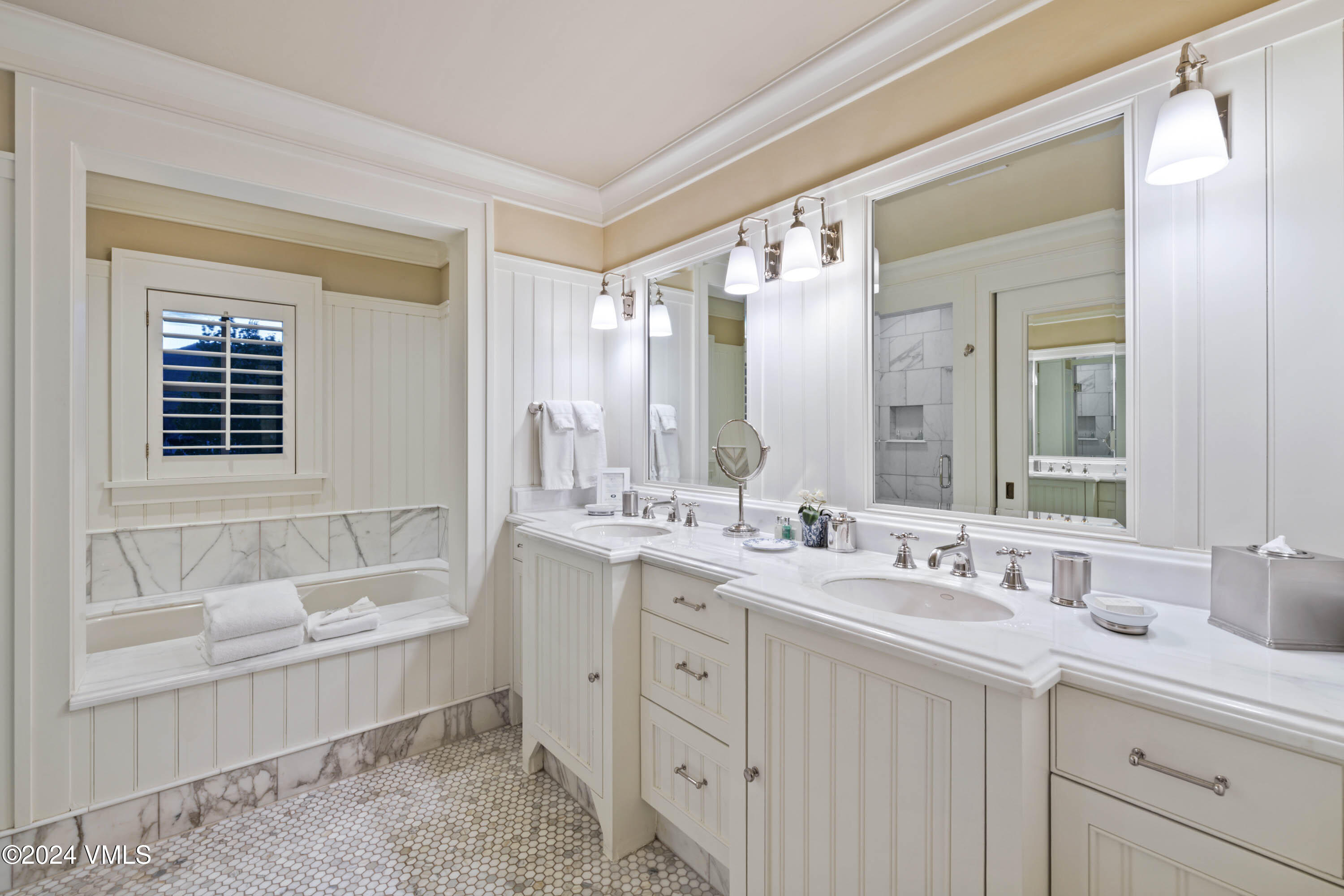 1 Willow Bridge Road, Unit 31 Vail, CO 81657 - Photo 17 of 39 a bathroom with a granite countertop double vanity sink a mirror and a bathtub