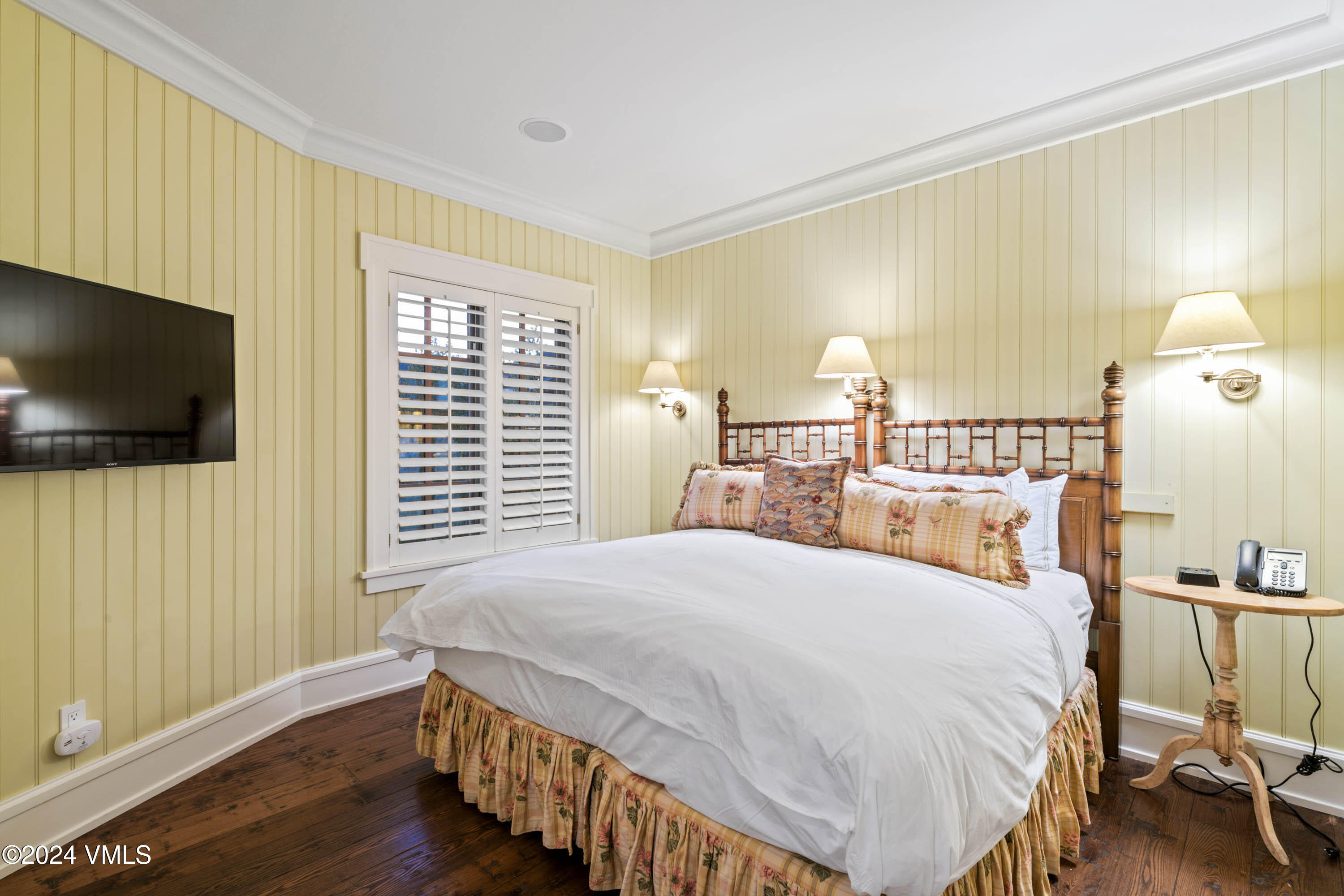 1 Willow Bridge Road, Unit 31 Vail, CO 81657 - Photo 20 of 39 a bedroom with a bed and a flat screen tv