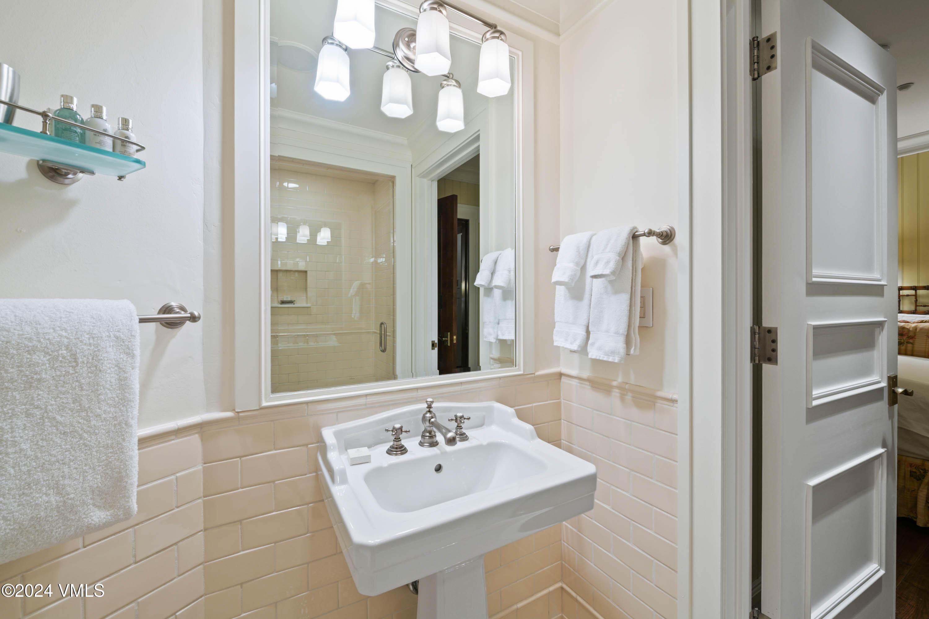 1 Willow Bridge Road, Unit 31 Vail, CO 81657 - Photo 21 of 39 a bathroom with a sink a mirror and a shower