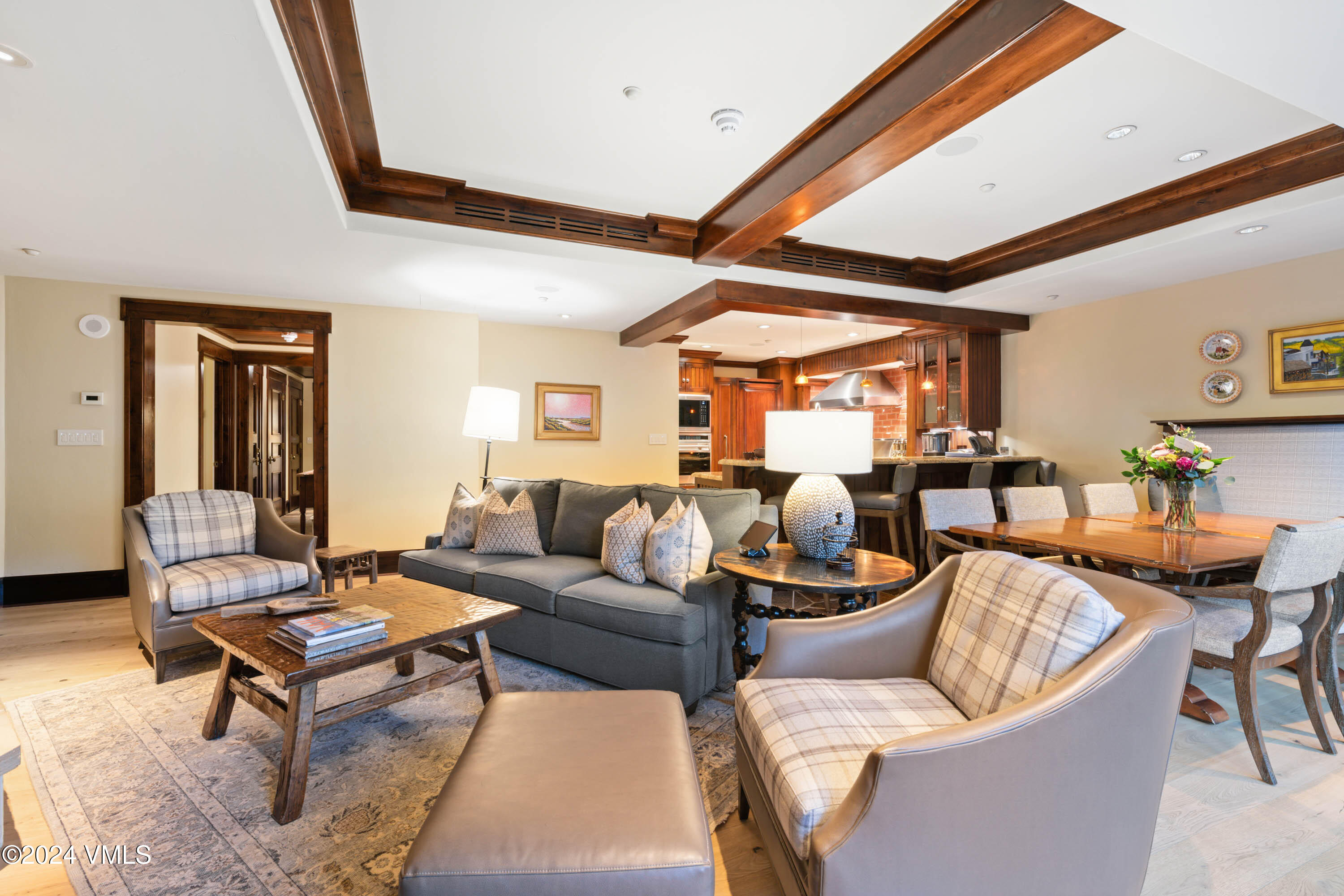 1 Willow Bridge Road, Unit 31 Vail, CO 81657 - Photo 6 of 39 a living room with furniture a rug potted plant and a large window