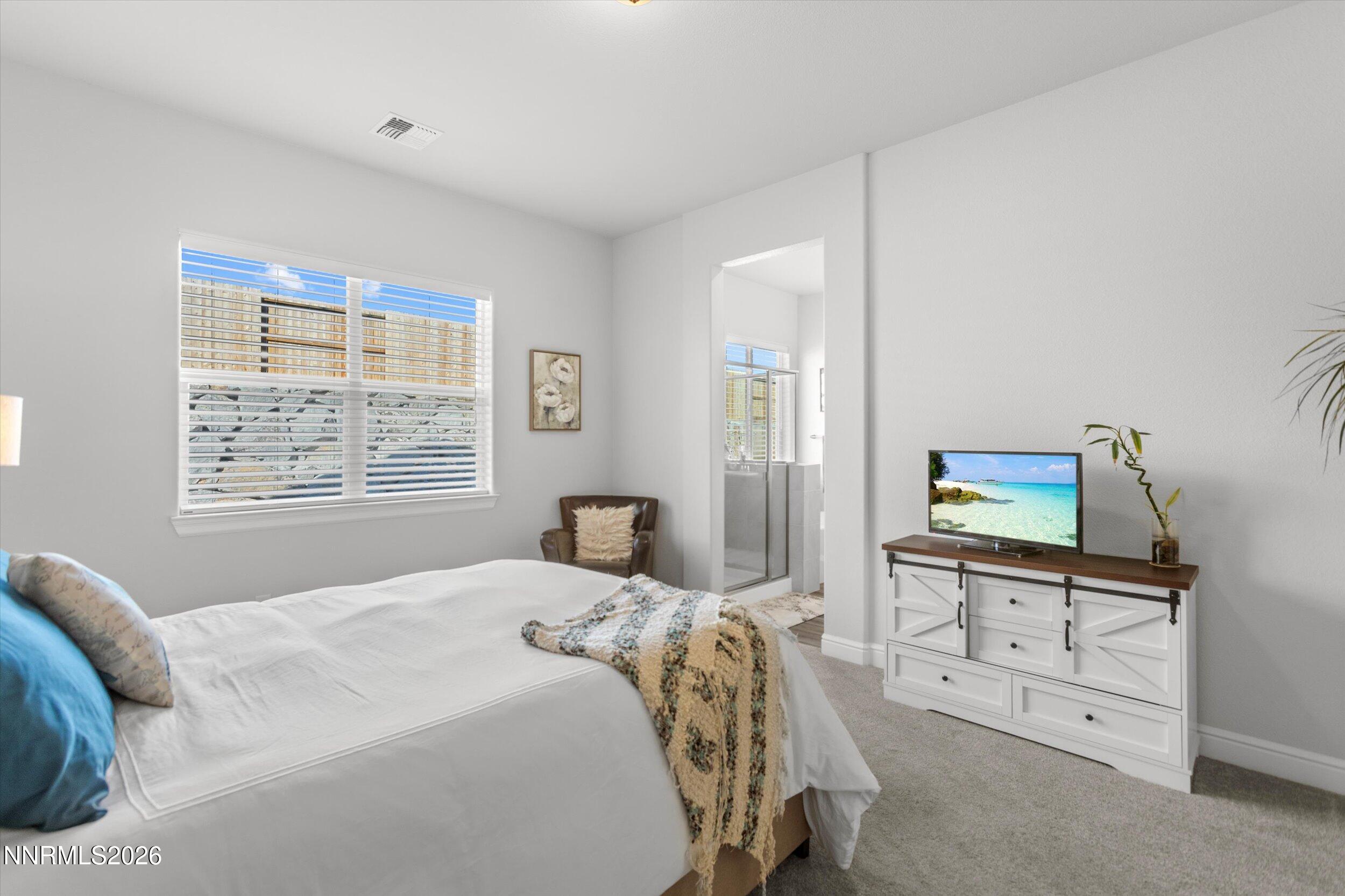 11125 Gallaudet Drive Reno, NV 89506 - Photo 15 of 32 a bedroom with a bed and a window