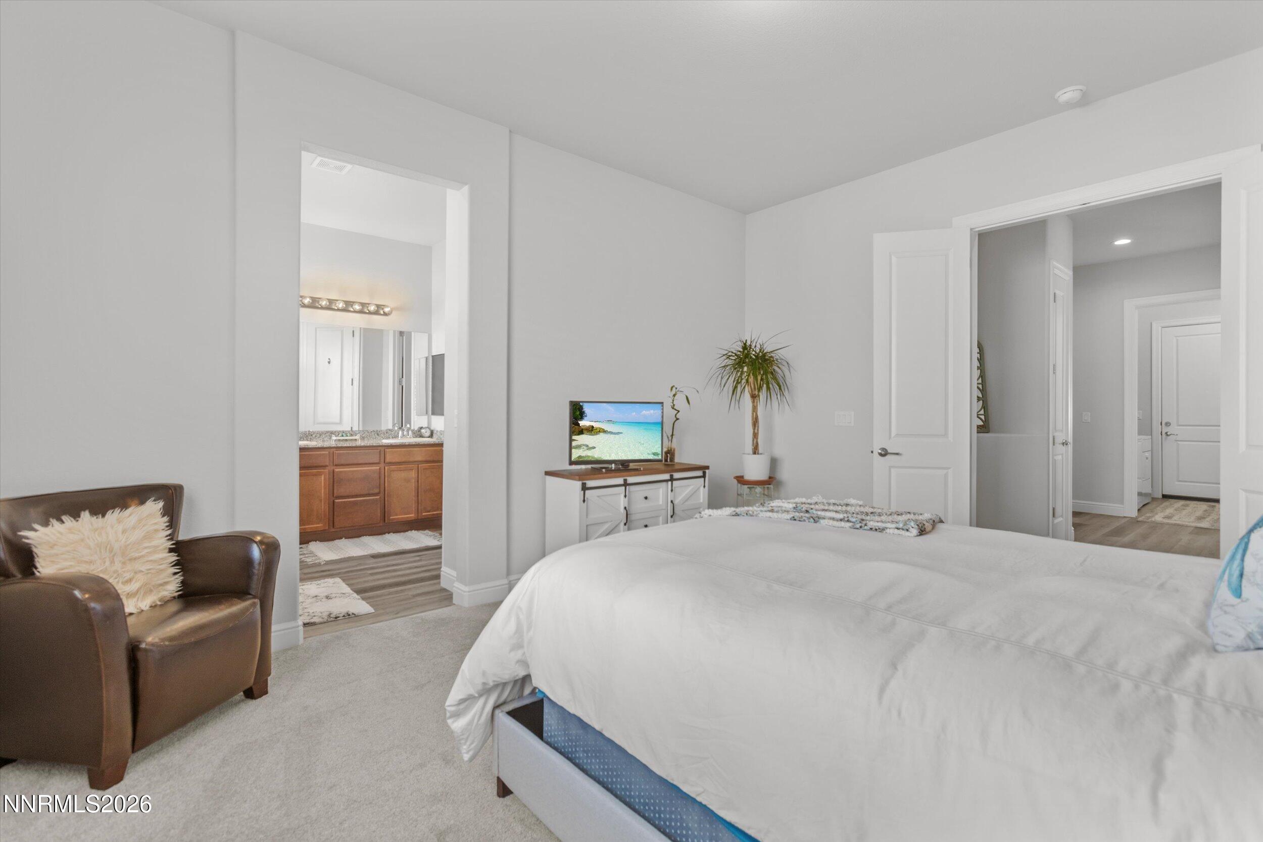 11125 Gallaudet Drive Reno, NV 89506 - Photo 16 of 32 a bedroom with a bed and a couch