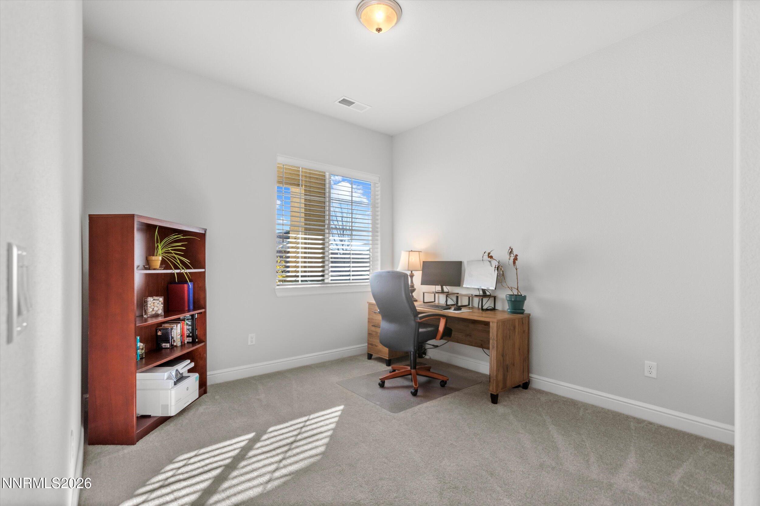 11125 Gallaudet Drive Reno, NV 89506 - Photo 19 of 32 a view of a workspace with furniture and a window