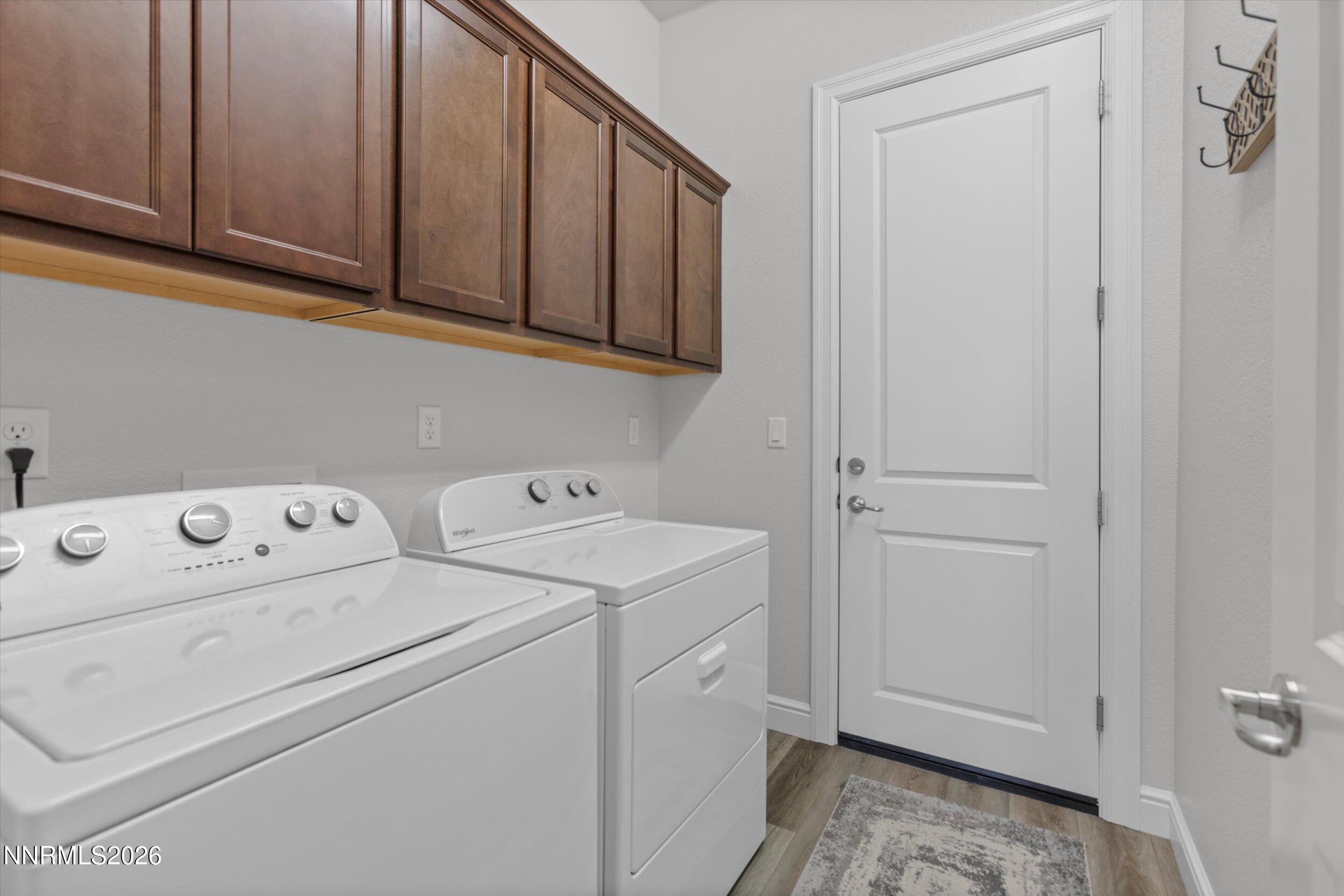 11125 Gallaudet Drive Reno, NV 89506 - Photo 23 of 32 a view of storage and utility room with washer and dryer