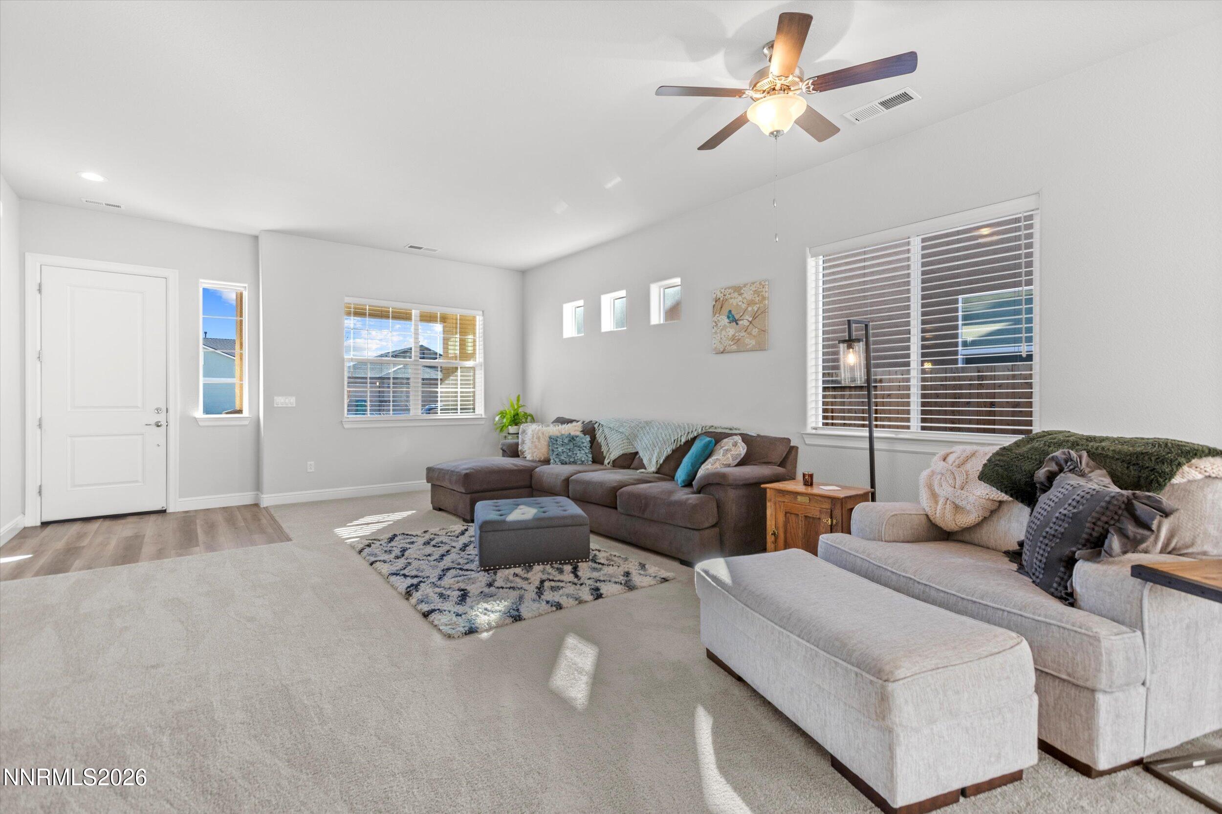 11125 Gallaudet Drive Reno, NV 89506 - Photo 5 of 32 a living room with furniture and a window