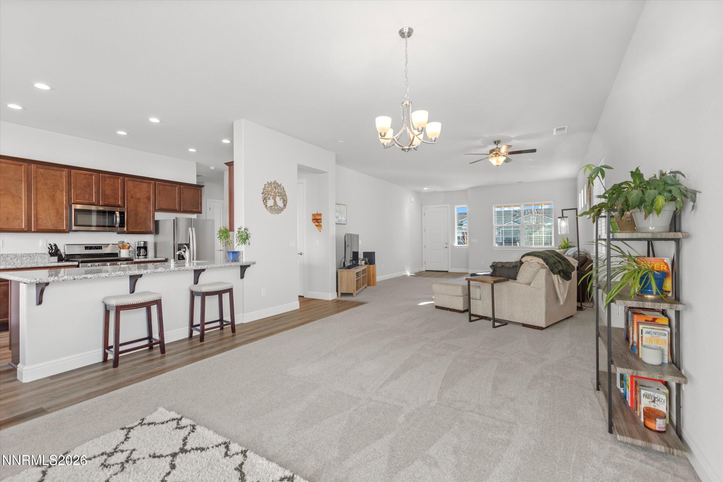 11125 Gallaudet Drive Reno, NV 89506 - Photo 8 of 32 a view of a kitchen and dining area with furniture