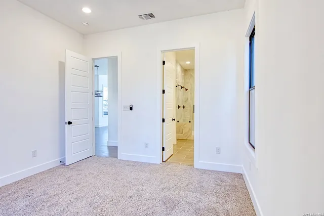 a bathroom with a shower sink and mirror