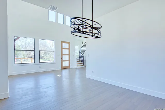 a view of an entryway with wooden floor