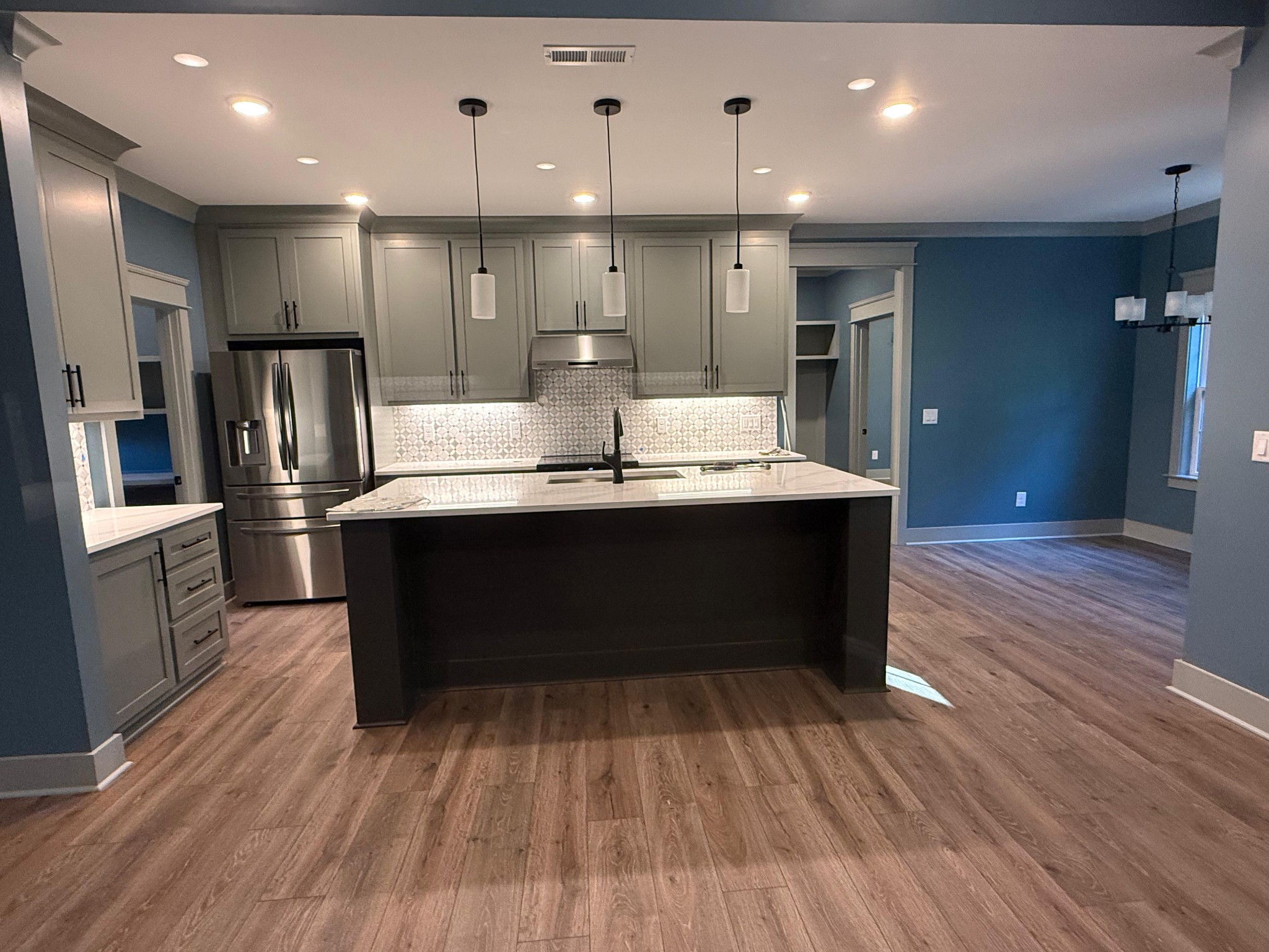 0 Sarvis Ridge Road Normandy, TN 37360 - Photo 3 of 22 a dining hall with stainless steel appliances kitchen island wooden floors and granite counter tops