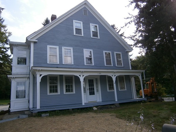 125 West Main Street Rindge, NH 03461 - Photo 1 of 19 a front view of a house with a garden