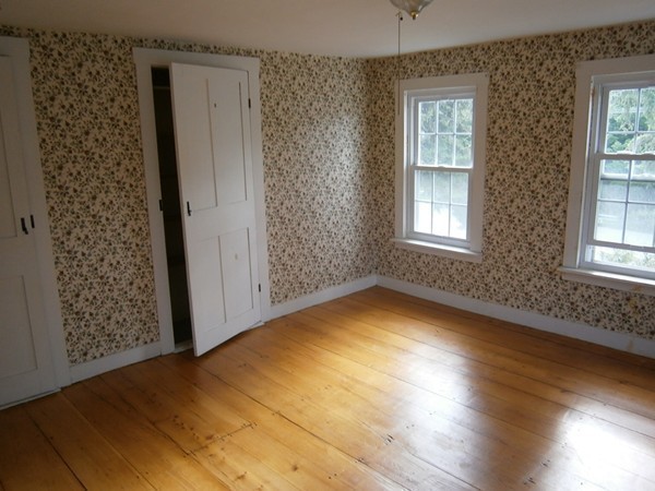 125 West Main Street Rindge, NH 03461 - Photo 16 of 19 an empty room with wooden floor and windows