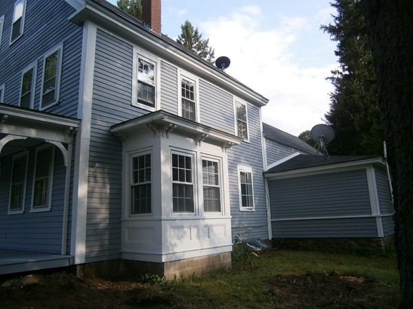 125 West Main Street Rindge, NH 03461 - Photo 3 of 19 a view of a house with a yard
