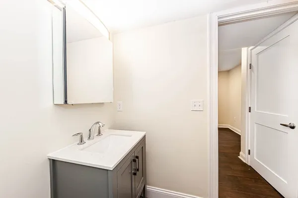a bathroom with a sink and a mirror