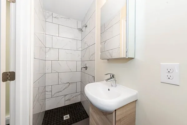 a bathroom with a sink and a window