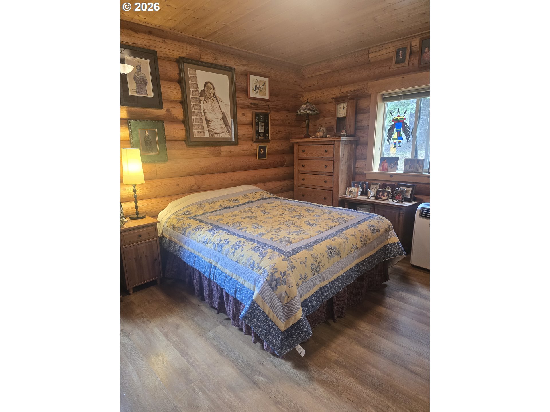 64276 Tamarack Road Lostine, OR 97857 - Photo 11 of 23 a bed sitting in a bedroom next to a window