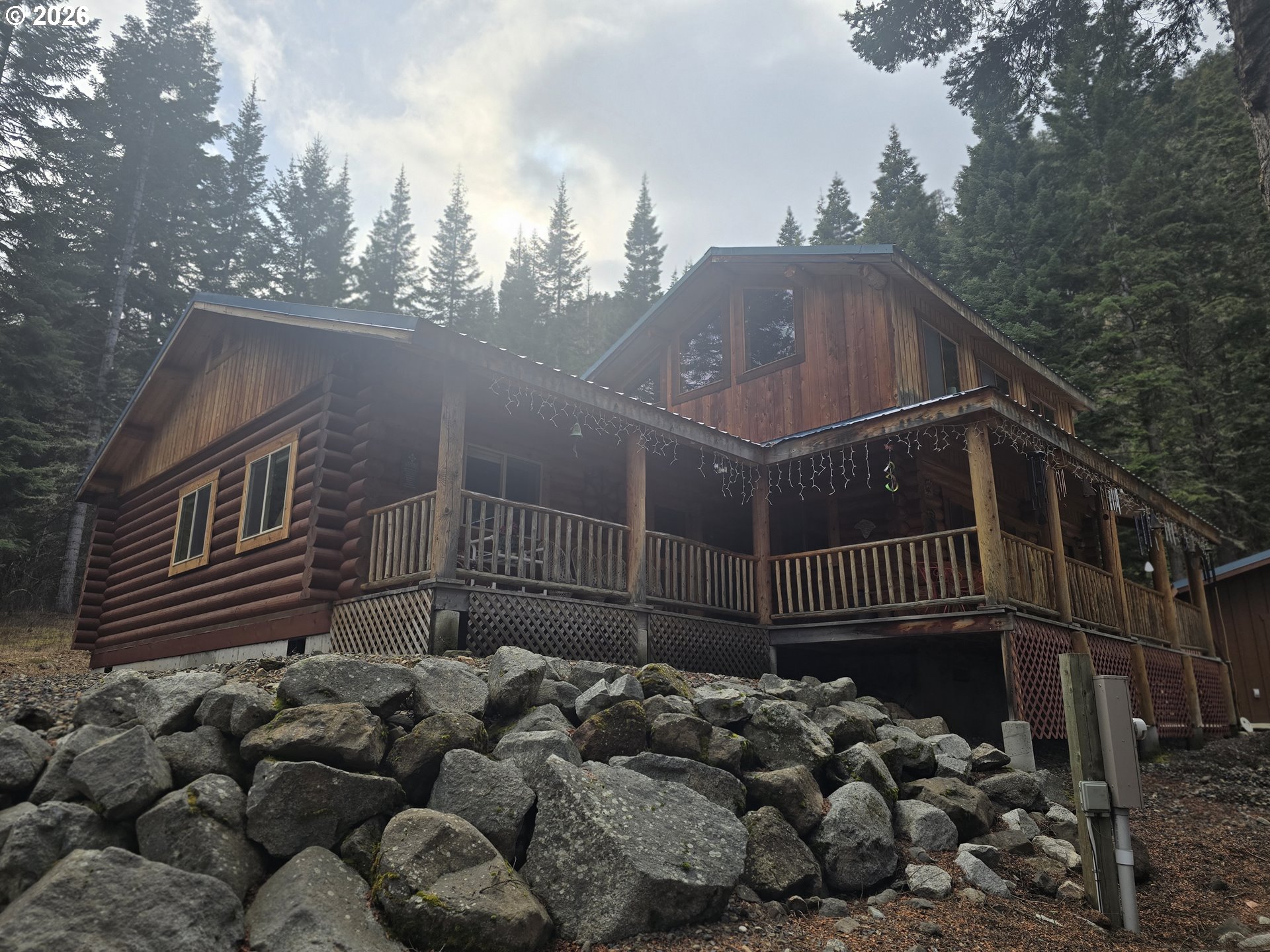 64276 Tamarack Road Lostine, OR 97857 - Photo 3 of 23 a view of street along with trees and buildings in the background