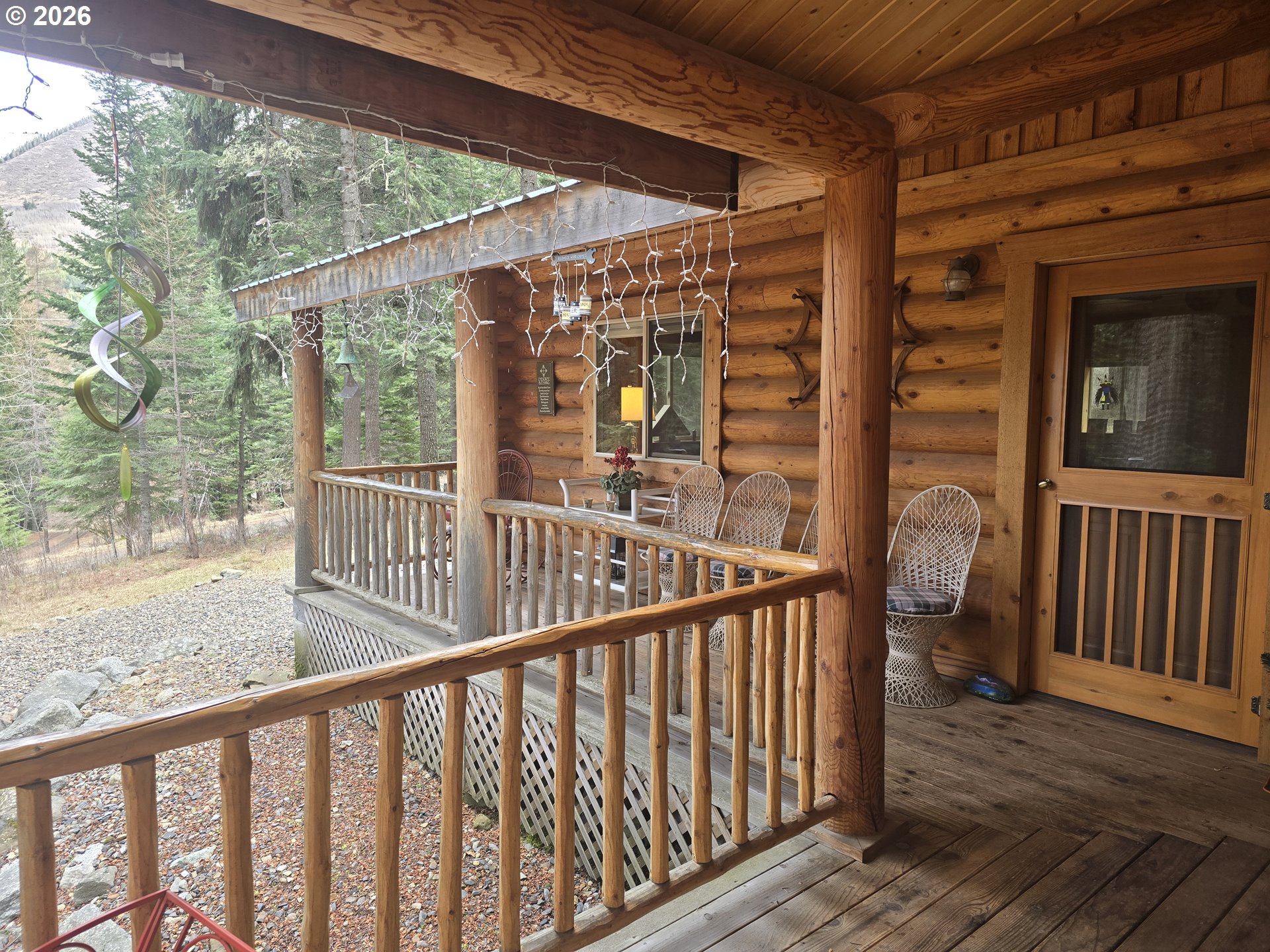 64276 Tamarack Road Lostine, OR 97857 - Photo 4 of 23 a view of a balcony with wooden floor