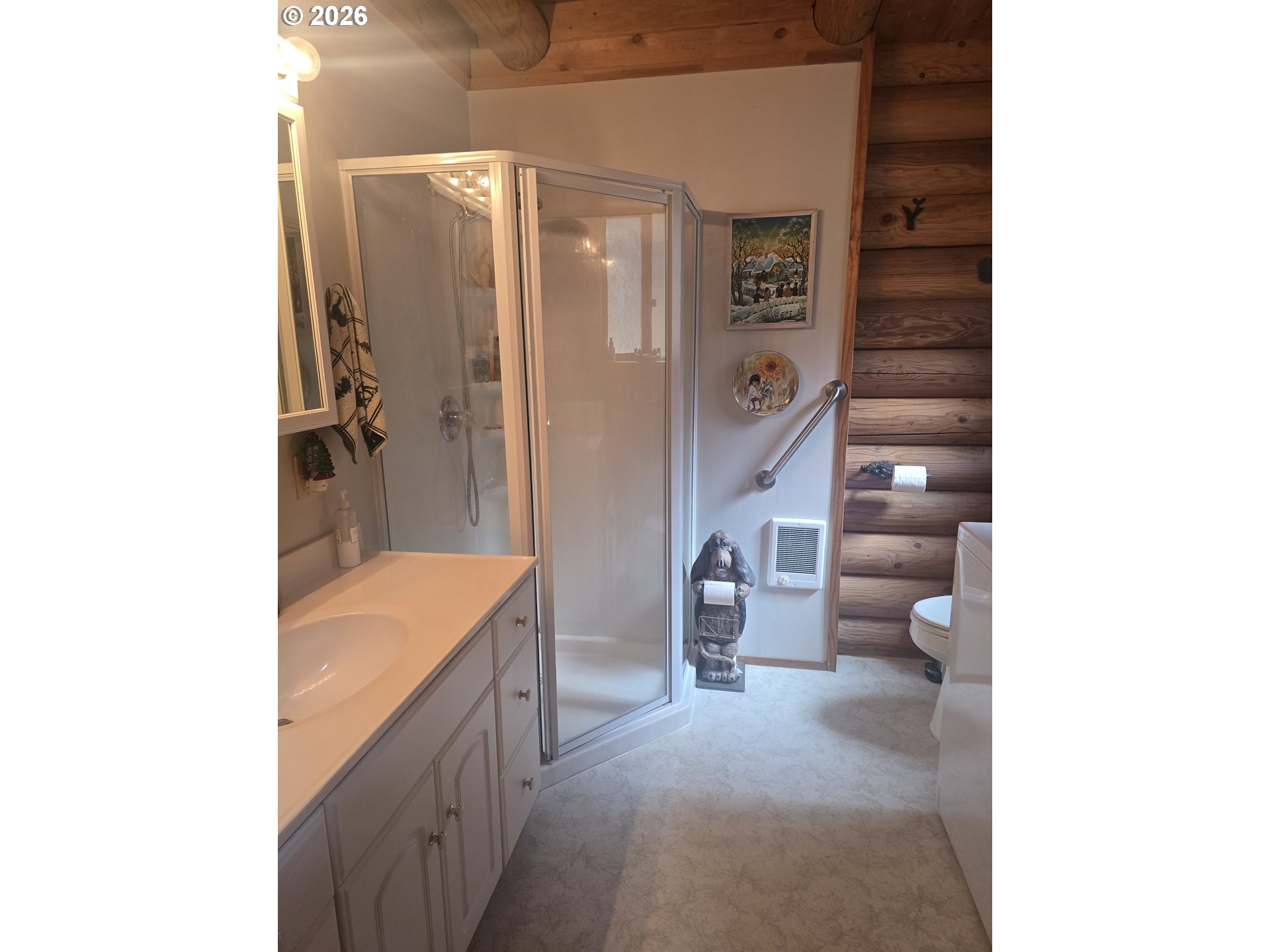 64276 Tamarack Road Lostine, OR 97857 - Photo 8 of 23 a bathroom with a double vanity sink toilet and shower