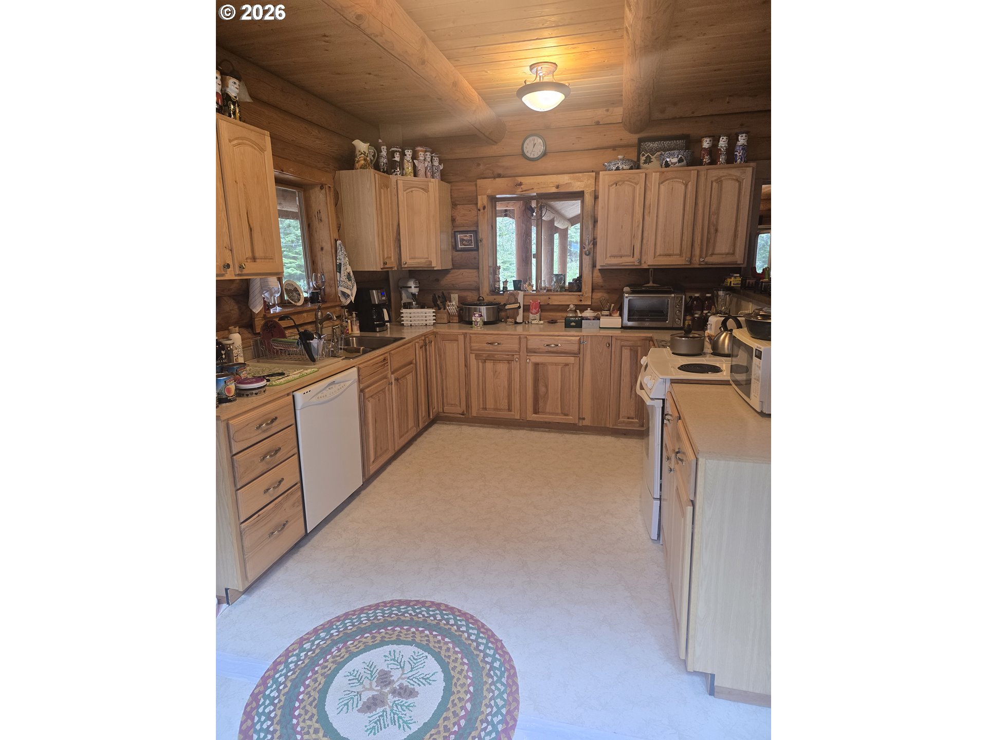 64276 Tamarack Road Lostine, OR 97857 - Photo 9 of 23 a kitchen with a sink cabinets and appliances