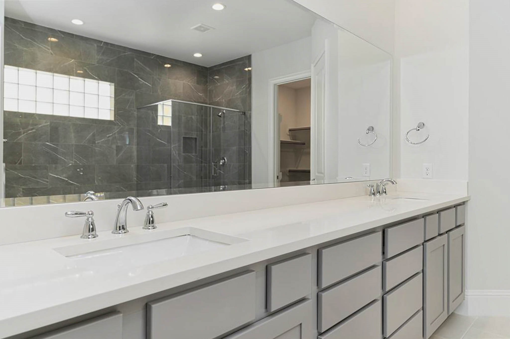 7715 South Fall Run Crossing Houston, TX 77055 - Photo 12 of 22 a bathroom with a sink and a mirror