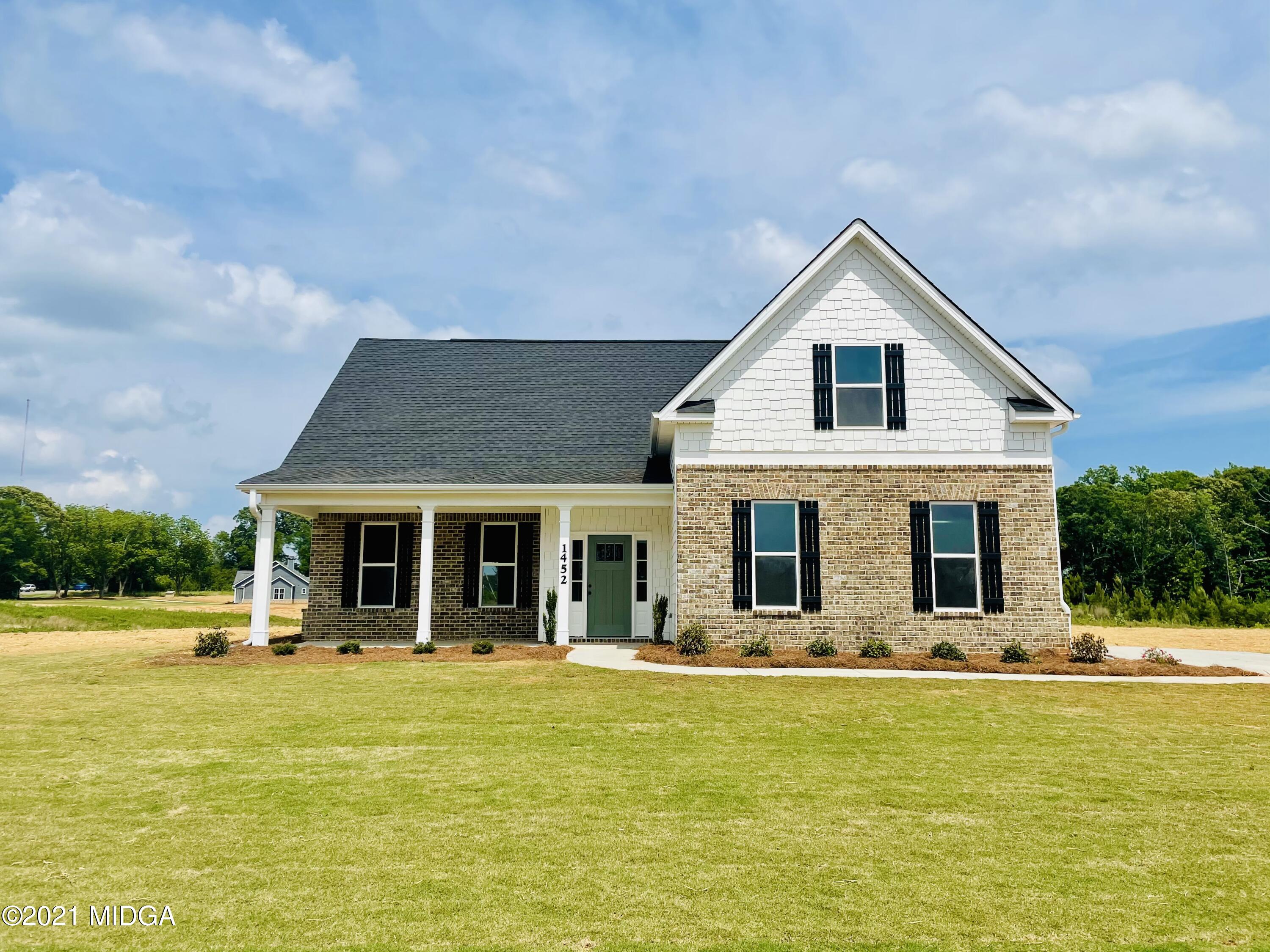 1452 Bunn Road Forsyth, GA 31029 - Photo 1 of 9 a view of a house with a swimming pool