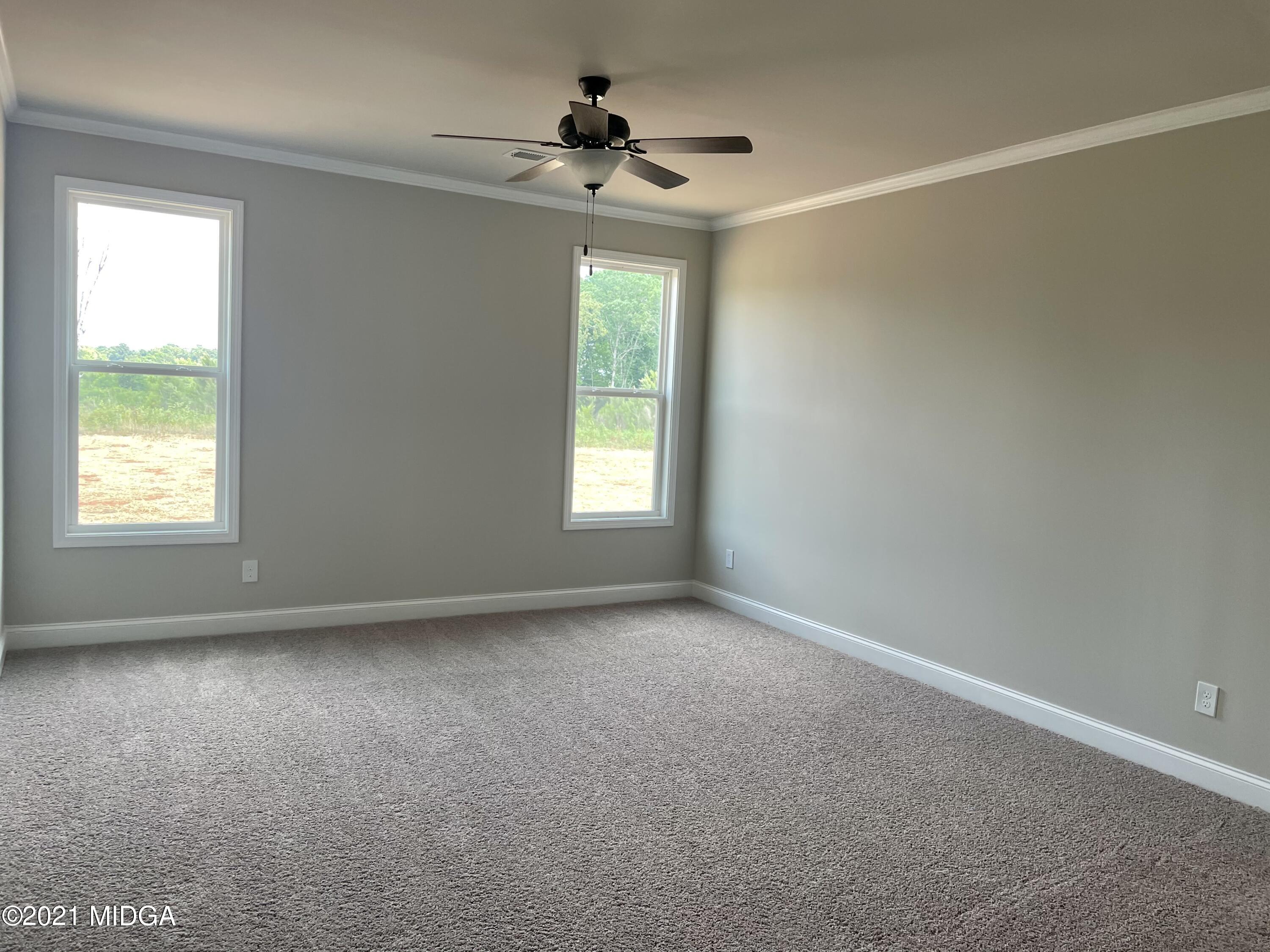 1452 Bunn Road Forsyth, GA 31029 - Photo 7 of 9 a view of an empty room with a window
