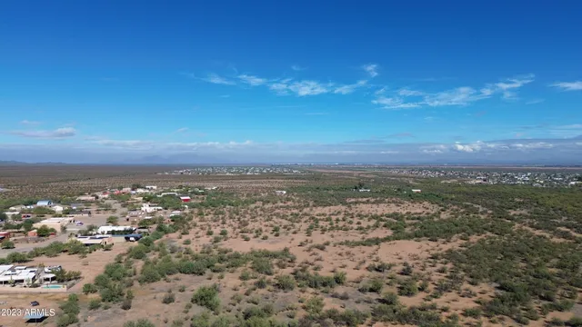 an aerial view of residential houses with city view