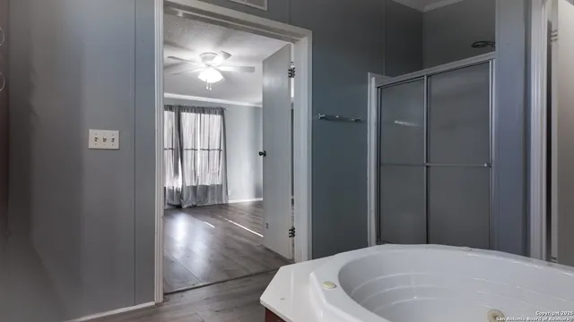 a bathroom with a bathtub and a shower