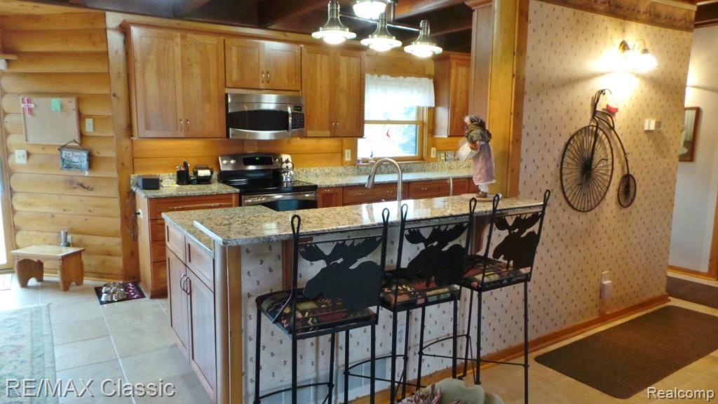 2447 North Hacker Road Howell, MI 48855 - Photo 5 of 62 Kitchen counter gathering area