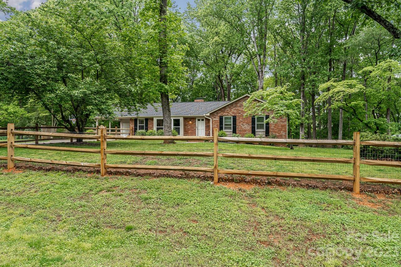 240 Hidden Hut Road Salisbury, NC 28147 - Photo 1 of 32 a front view of a house with a yard