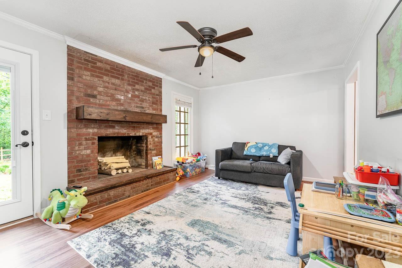 240 Hidden Hut Road Salisbury, NC 28147 - Photo 11 of 32 a living room with furniture and a fireplace
