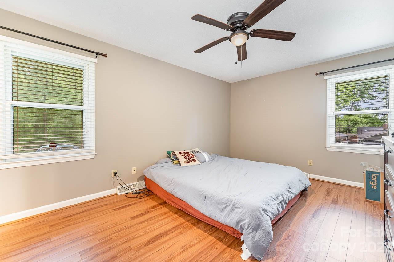 240 Hidden Hut Road Salisbury, NC 28147 - Photo 19 of 32 a bedroom with a bed and a window