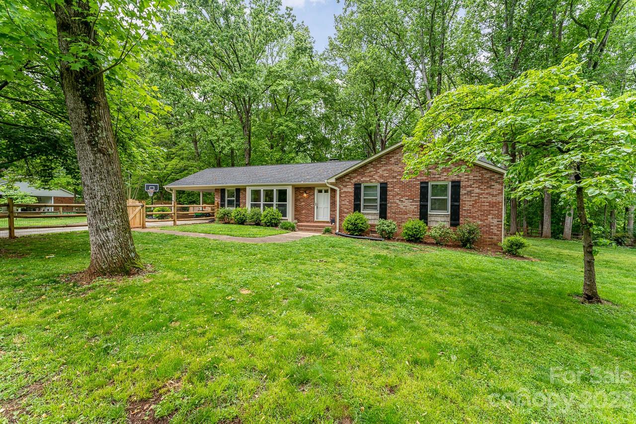 240 Hidden Hut Road Salisbury, NC 28147 - Photo 2 of 32 a front view of a house with a yard