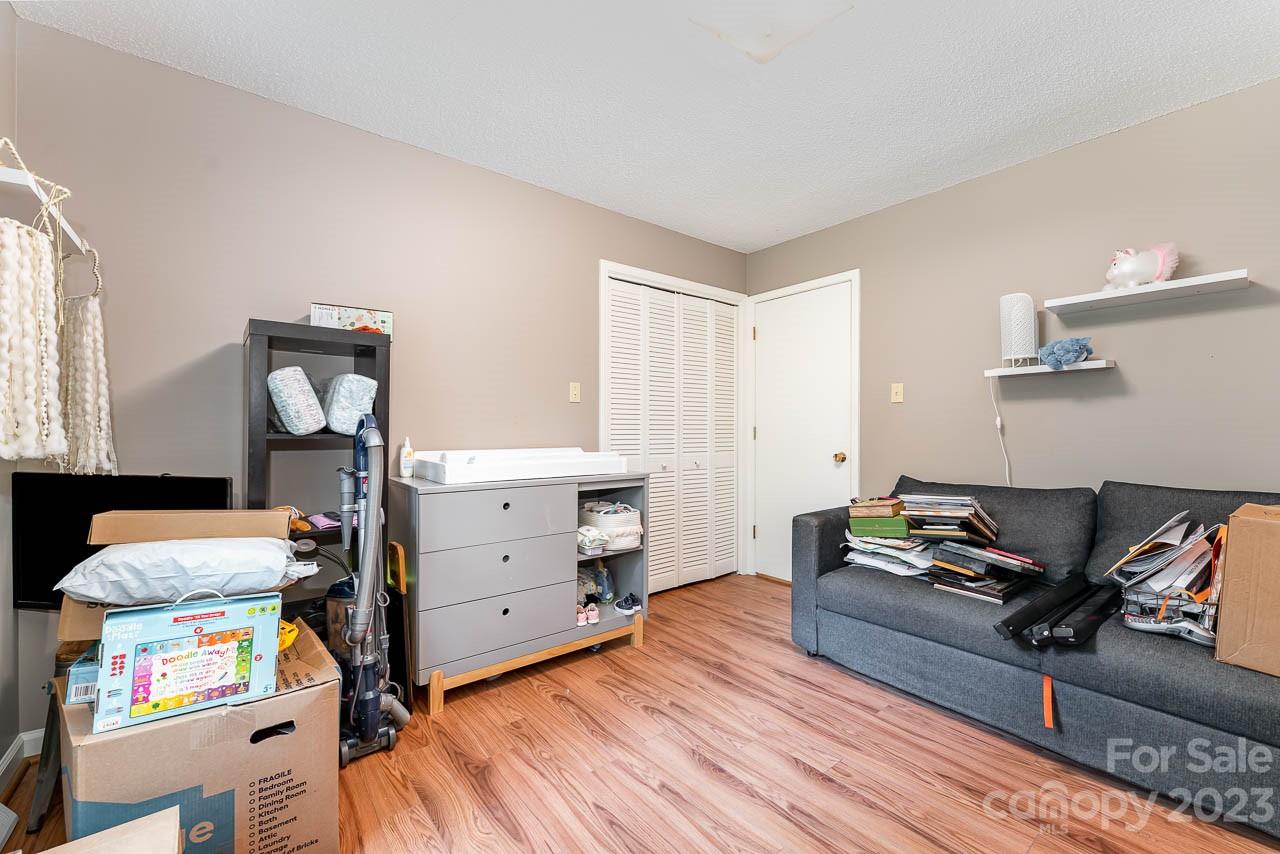 240 Hidden Hut Road Salisbury, NC 28147 - Photo 24 of 32 a bedroom with furniture and a wooden floor
