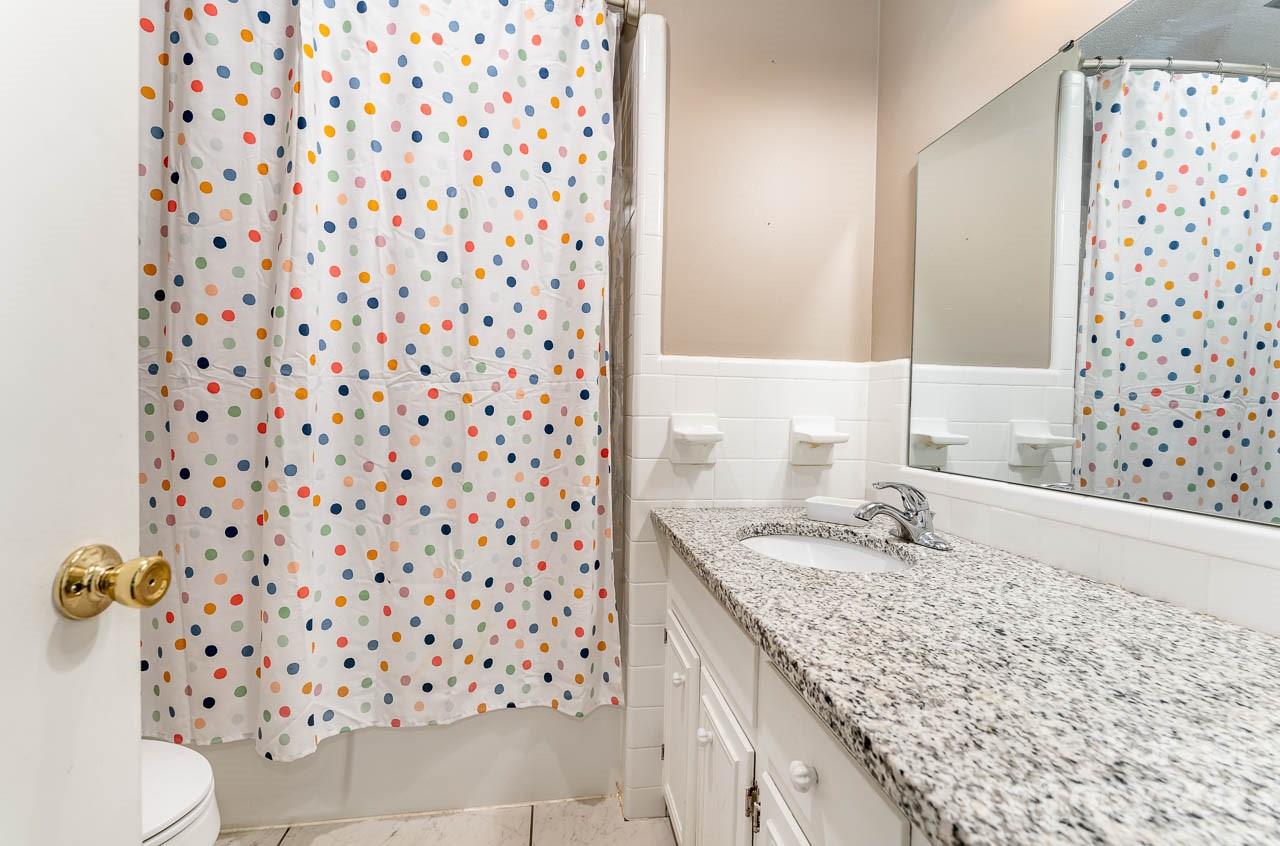 240 Hidden Hut Road Salisbury, NC 28147 - Photo 25 of 32 a bathroom with a granite countertop sink toilet and shower