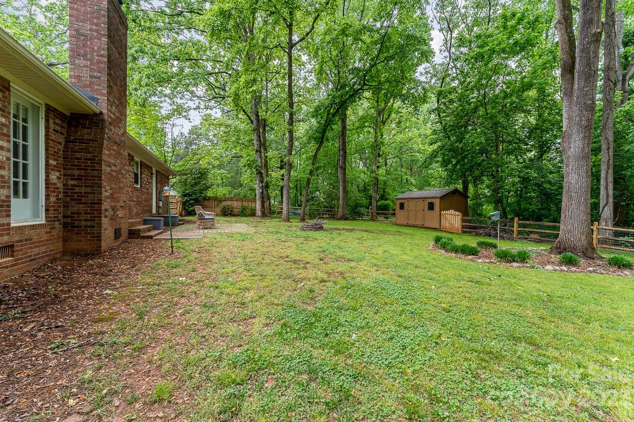 240 Hidden Hut Road Salisbury, NC 28147 - Photo 31 of 32 a backyard of a house with trampoline