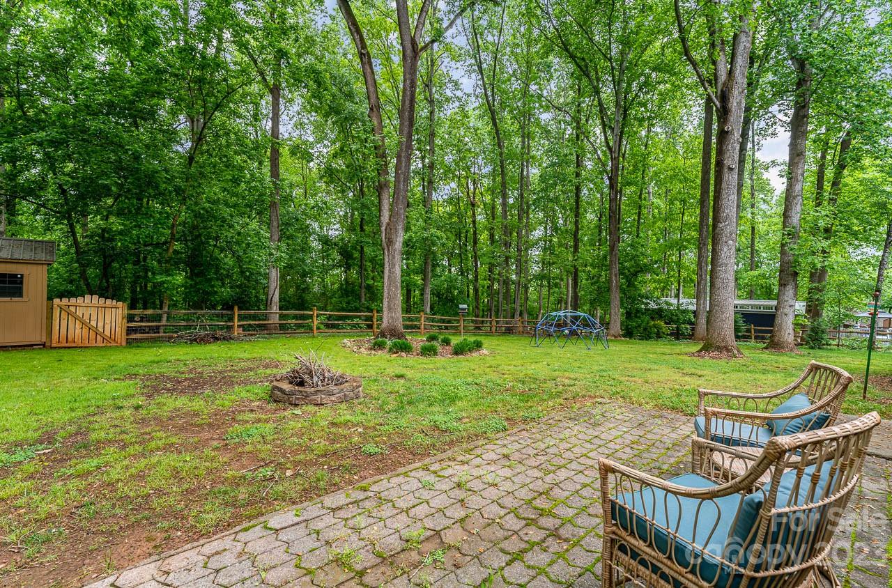 240 Hidden Hut Road Salisbury, NC 28147 - Photo 32 of 32 a view of a wooden deck with a yard