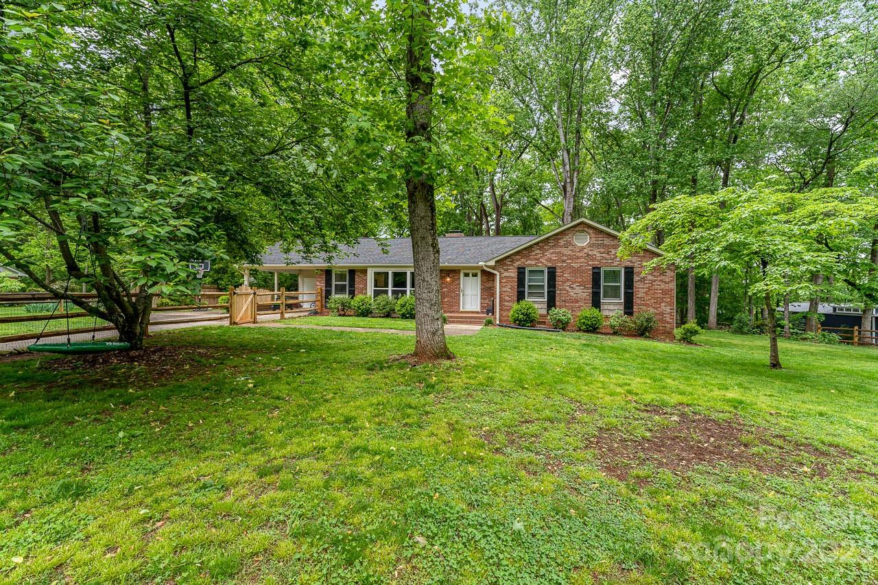 240 Hidden Hut Road Salisbury, NC 28147 - Photo 4 of 32 a front view of a house with a yard