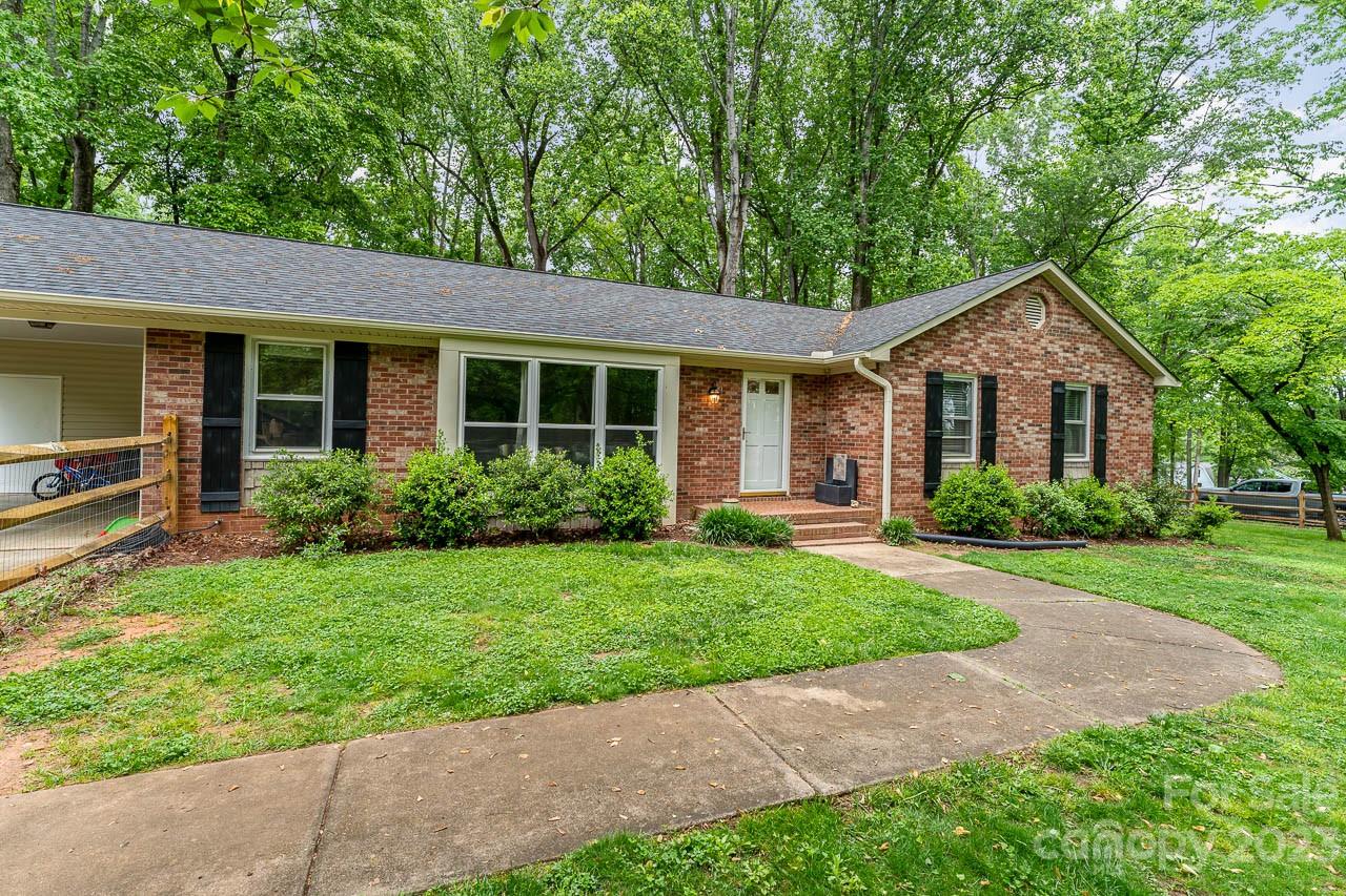 240 Hidden Hut Road Salisbury, NC 28147 - Photo 5 of 32 a front view of a house with a yard