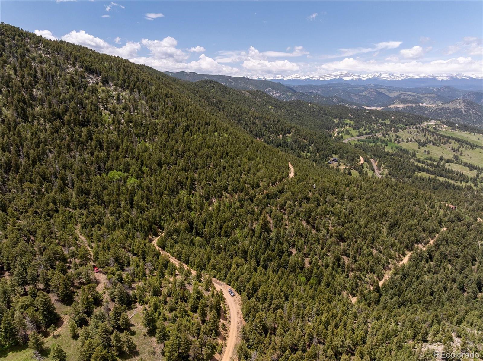 1259 Chute Road Golden, CO 80403 - Photo 7 of 21 a view of a city with mountains in the background