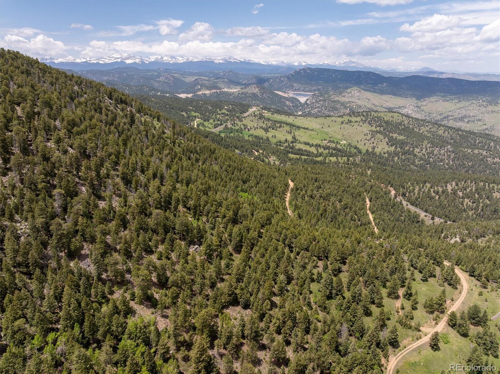 1259 Chute Road Golden, CO 80403 - Photo 8 of 21 a view of a city with lush green forest