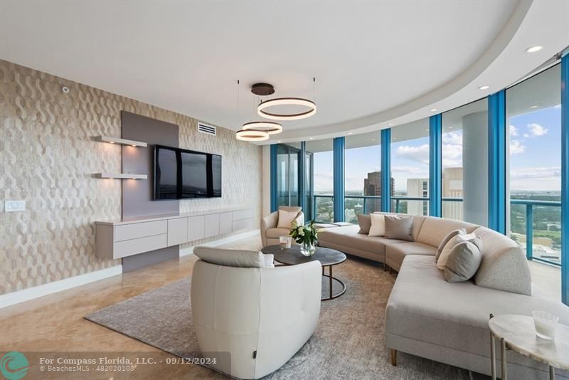 333 Las Olas Way, Unit 31023103 Fort Lauderdale, FL 33301 - Photo 1 of 37 a living room with furniture and a flat screen tv