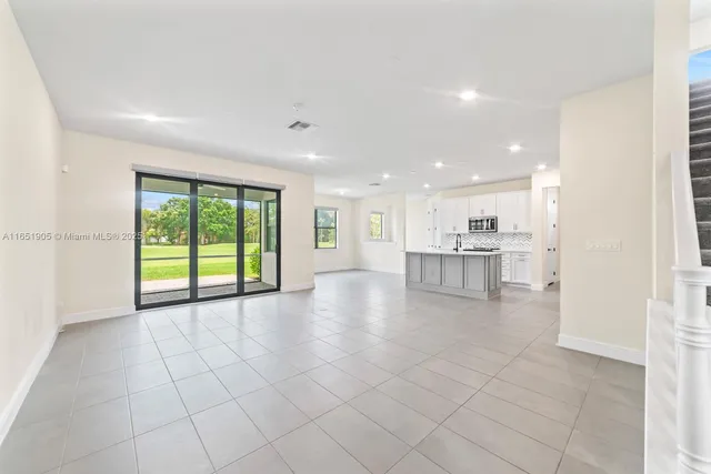 a view of a kitchen with furniture and a window