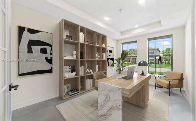 a living room with furniture and a floor to ceiling window