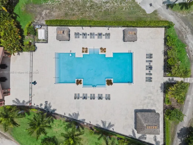 a view of outdoor kitchen with outdoor seating