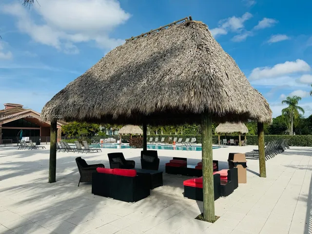 a living room with lots of furniture and a chandelier